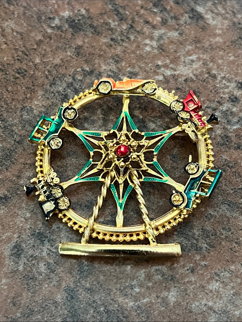Gold-Tone Ferris Wheel Brooch with Green and Red Accents